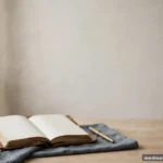 A dated journal with blank pages beside a pen on a calm desk, no legible text