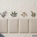 Four neat blank envelopes in a row on a light surface, quarterly motif, no text